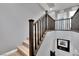 Modern staircase with dark wood railings leading to the second floor at 4151 San Cuervo Way, Las Vegas, NV 89115