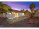 Evening view of backyard patio and home exterior at 433 Old Palms Dr, Las Vegas, NV 89123