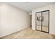 Spacious bedroom featuring a mirrored closet and neutral walls at 433 Old Palms Dr, Las Vegas, NV 89123