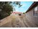 Landscaped side yard with stepping stones leading to a gate at 4417 Socrates St, North Las Vegas, NV 89031