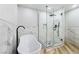 Modern bathroom with soaking tub, frameless glass shower, and marble tile at 491 Kristin Ln, Henderson, NV 89011