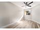 Light-filled bedroom featuring hardwood floors and a large window at 491 Kristin Ln, Henderson, NV 89011