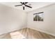 Bright bedroom with wood-look floors and ceiling fan at 491 Kristin Ln, Henderson, NV 89011