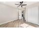 Bedroom with wood-look floors, ceiling fan, and closet at 491 Kristin Ln, Henderson, NV 89011