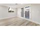 Bright bedroom with patio access and laminate wood flooring at 491 Kristin Ln, Henderson, NV 89011