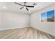 Bedroom with wood-look floors and ceiling fan at 491 Kristin Ln, Henderson, NV 89011