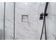 Modern shower with marble tile and black fixtures at 491 Kristin Ln, Henderson, NV 89011