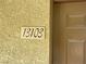 Close-up of the building's address marker at 50 Aura De Blanco St # 13103, Henderson, NV 89074