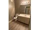 Clean bathroom with vanity, toilet, and updated flooring at 50 Aura De Blanco St # 13103, Henderson, NV 89074