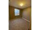 Simple bedroom with window and neutral carpeting at 50 Aura De Blanco St # 13103, Henderson, NV 89074