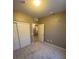 Spacious bedroom with double doors leading to closet and access to hallway at 50 Aura De Blanco St # 13103, Henderson, NV 89074