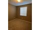 Well-lit bedroom with window and neutral carpeting at 50 Aura De Blanco St # 13103, Henderson, NV 89074