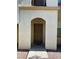 Inviting entryway with a brown door and stone address marker at 50 Aura De Blanco St # 13103, Henderson, NV 89074