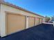 Row of attached garages with tan doors at 50 Aura De Blanco St # 13103, Henderson, NV 89074