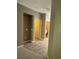 Bright hallway with wood-look flooring and doors to rooms at 50 Aura De Blanco St # 13103, Henderson, NV 89074