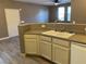 Kitchen with double sink, dishwasher and wood-look floors at 50 Aura De Blanco St # 13103, Henderson, NV 89074