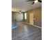 Spacious living room with gray walls, wood-look floors and ceiling fan at 50 Aura De Blanco St # 13103, Henderson, NV 89074