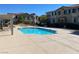 Community pool with patio furniture and pergola at 50 Aura De Blanco St # 13103, Henderson, NV 89074