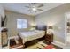 Comfortable bedroom with ceiling fan and en-suite bathroom at 5250 S Rainbow Blvd # 2032, Las Vegas, NV 89118