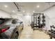 Garage gym with car and overhead storage at 5250 S Rainbow Blvd # 2032, Las Vegas, NV 89118