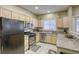 Modern kitchen with granite countertops and stainless steel appliances at 5250 S Rainbow Blvd # 2032, Las Vegas, NV 89118