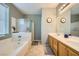 Bathroom with double sinks, shower, and bathtub at 5442 Bristol Bend Ct, Las Vegas, NV 89135