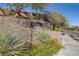 Ladera community entrance with stonework and landscaping at 5442 Bristol Bend Ct, Las Vegas, NV 89135