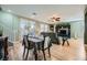 Open dining area with gray tablecloth and view into living room and backyard at 5442 Bristol Bend Ct, Las Vegas, NV 89135