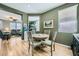 Bright dining room features a round table with four chairs, and view into living room at 5442 Bristol Bend Ct, Las Vegas, NV 89135