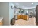 Modern kitchen with stainless steel appliances and light wood cabinets at 5442 Bristol Bend Ct, Las Vegas, NV 89135