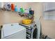 Bright laundry room with washer, dryer, and ample shelving at 5442 Bristol Bend Ct, Las Vegas, NV 89135