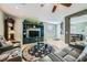 Living room with gray leather sofas and an entertainment center at 5442 Bristol Bend Ct, Las Vegas, NV 89135