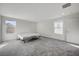 Well lit bedroom with window and grey carpet at 6201 Ashley Hills Ave, Las Vegas, NV 89141