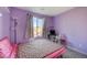 Cozy bedroom with pink accents and a window view at 6201 Ashley Hills Ave, Las Vegas, NV 89141