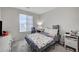 Simple bedroom with a double bed and window at 6201 Ashley Hills Ave, Las Vegas, NV 89141