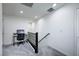 Bright loft hallway with a workspace and railing at 6201 Ashley Hills Ave, Las Vegas, NV 89141