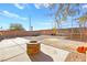 Backyard with fire pit, trampoline, and patio area at 6227 Legend Falls St, North Las Vegas, NV 89081