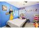 bedroom with a superhero theme and full-size bed at 6227 Legend Falls St, North Las Vegas, NV 89081