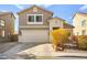 Two-story house with attached garage and landscaping at 6227 Legend Falls St, North Las Vegas, NV 89081