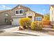 Two-story house with attached garage and landscaping at 6227 Legend Falls St, North Las Vegas, NV 89081