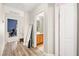 Light hallway with wood-look flooring, leading to bathroom and bedroom at 6227 Legend Falls St, North Las Vegas, NV 89081