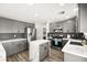 Modern kitchen with gray shaker cabinets, white quartz countertops, and island at 6227 Legend Falls St, North Las Vegas, NV 89081