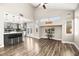 Open concept kitchen and living area with modern cabinetry and breakfast bar at 6227 Legend Falls St, North Las Vegas, NV 89081