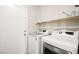 Convenient laundry room with washer, dryer, and storage at 6227 Legend Falls St, North Las Vegas, NV 89081