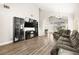 Spacious living room featuring hardwood floors and a fireplace at 6227 Legend Falls St, North Las Vegas, NV 89081