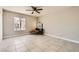 Bright bedroom with tile floors, a ceiling fan, and a window seat at 6381 W Washington Ave, Las Vegas, NV 89107