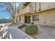 Inviting exterior of a two-story building with landscaping and walkways at 6381 W Washington Ave, Las Vegas, NV 89107