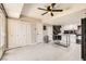 Open concept kitchen with island, white cabinets, and tile floor at 6381 W Washington Ave, Las Vegas, NV 89107