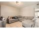 Spacious living room featuring a sectional sofa and tile floors at 6381 W Washington Ave, Las Vegas, NV 89107