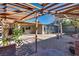 Relaxing backyard patio with pergola and rock garden at 6725 Carrera Dr, Las Vegas, NV 89103